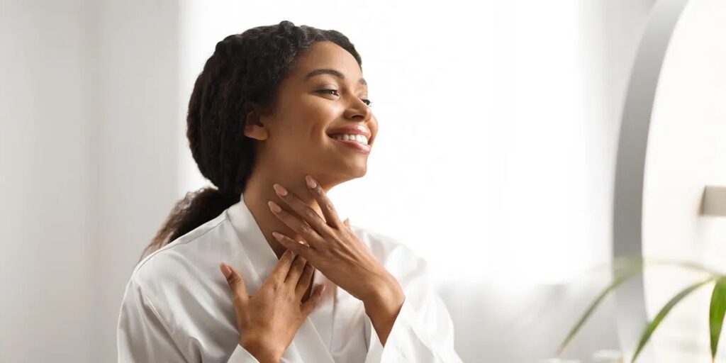 Woman touching her neck after a neck lift combination